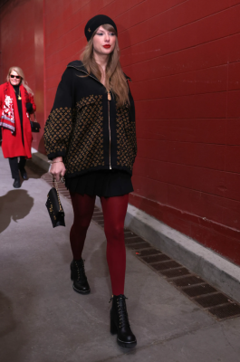 Wearing a monogrammed Louis Vuitton jacket, bag, and shoes. Related Video Ariana Grande's 'Wicked' Mother of Pearl Met Gala Dress