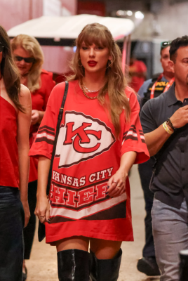 Wearing an oversized Chiefs T-shirt.